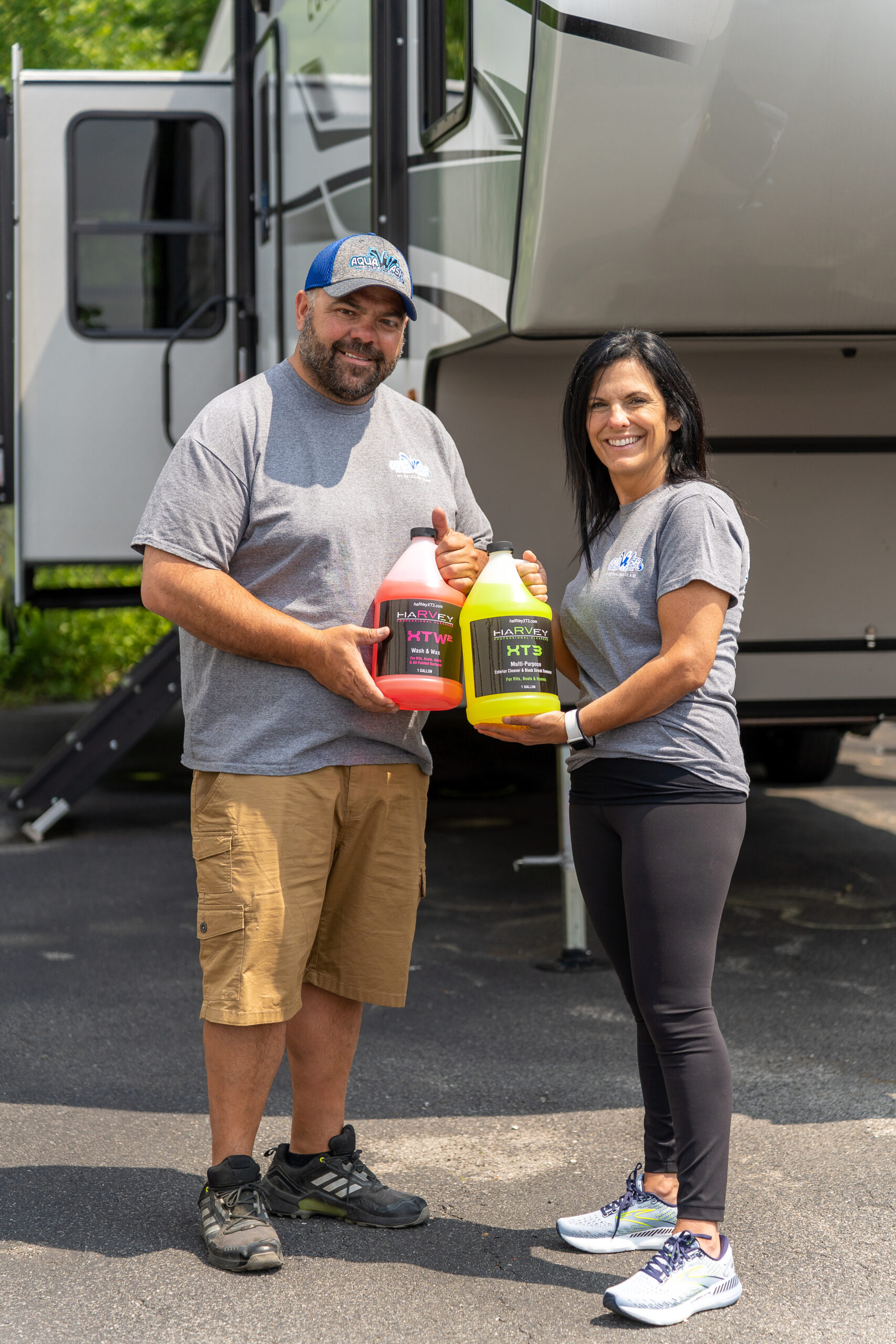 Aqua Wash owners holding HaRVey products